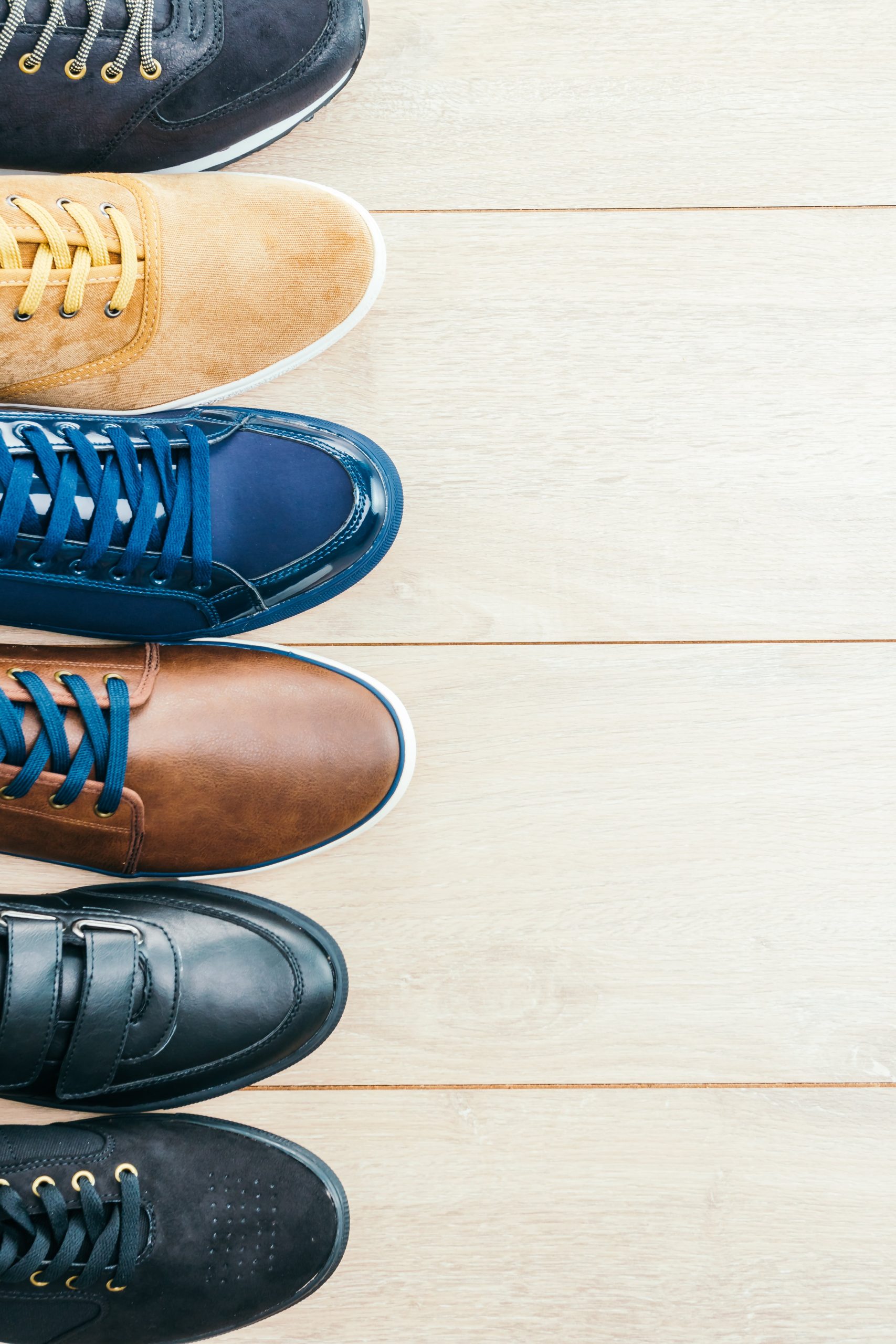 Leather Shoes Wooden Background Min Scaled
