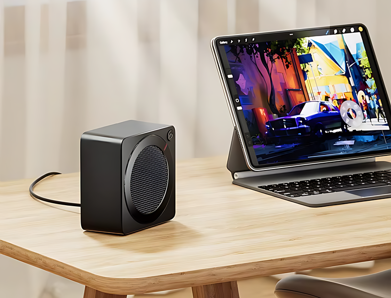 Radiateur électrique compact utilisé sur un bureau de travail